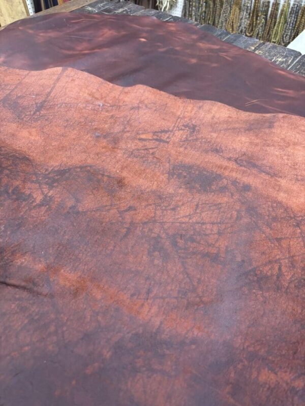 IMG_2715 Close-up of brown leather with texture.