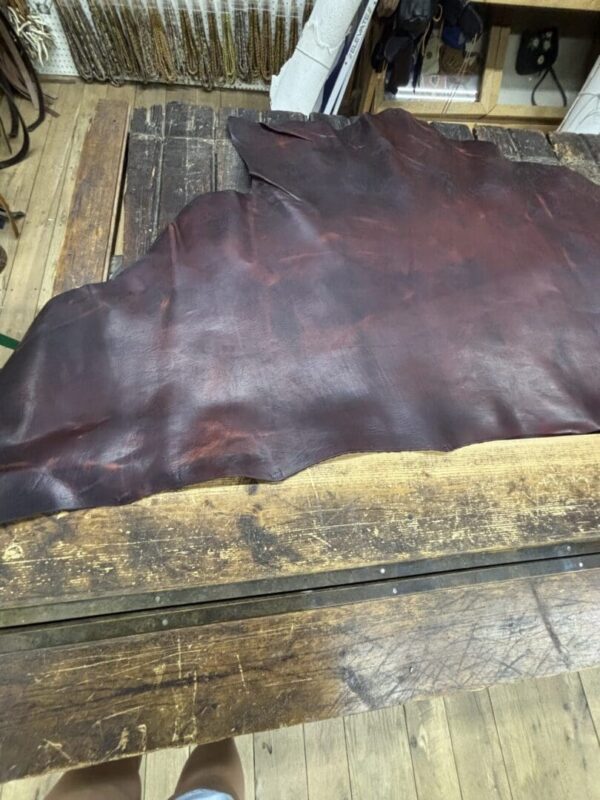 Brown leather on wooden table.