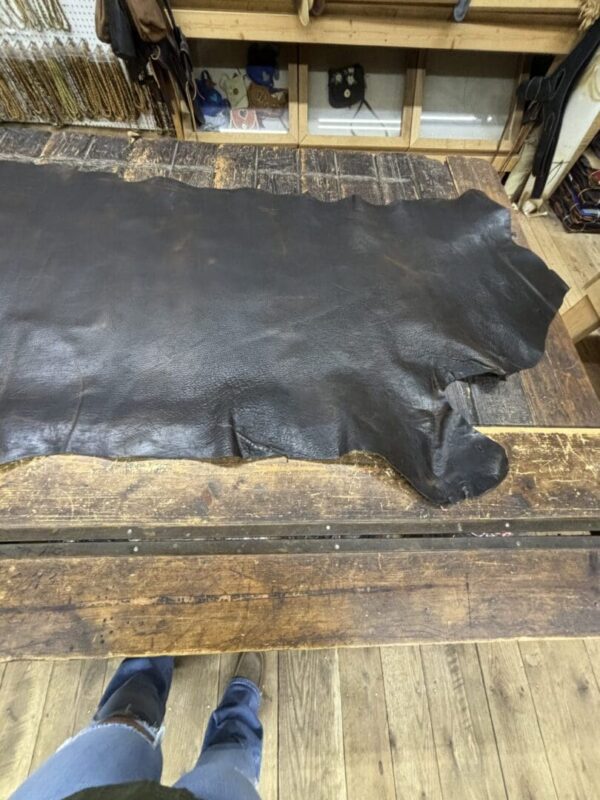 Large piece of brown leather on a table.