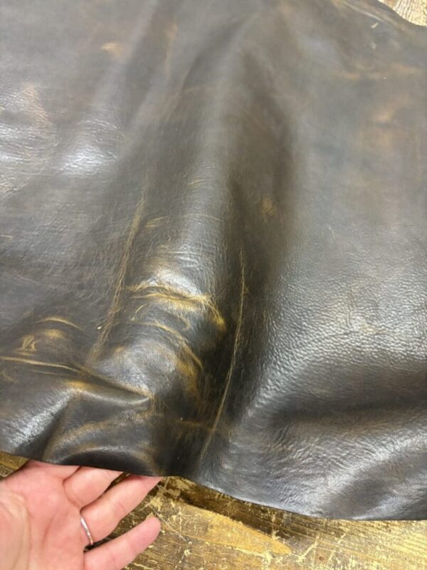 Dark brown leather with distressed finish.