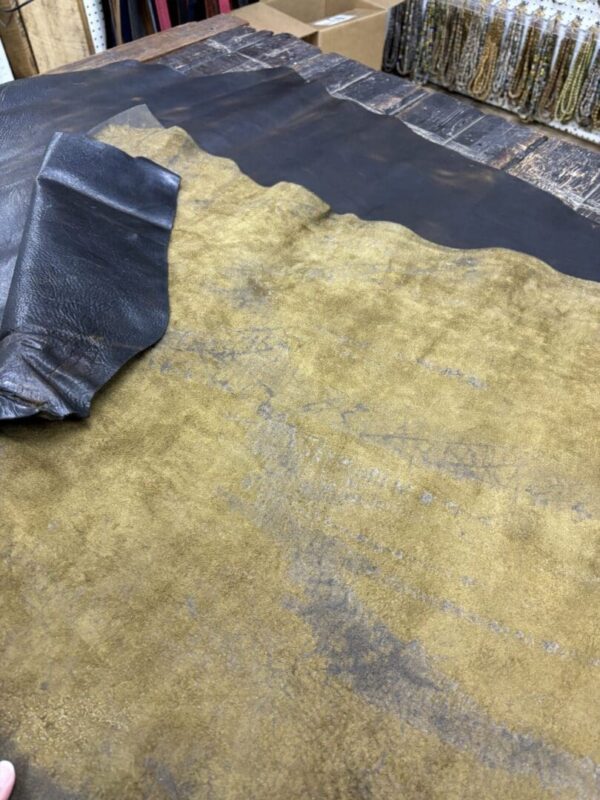 Two pieces of leather on a table.