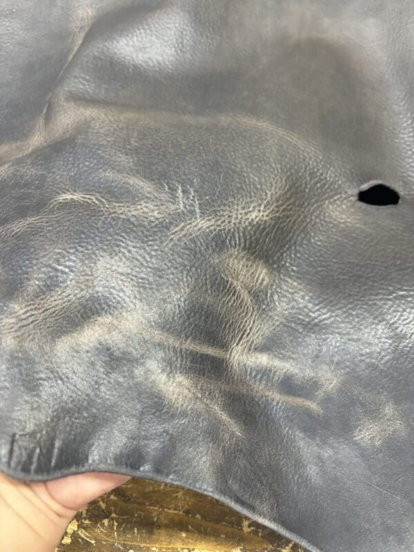 Close-up of worn gray leather.