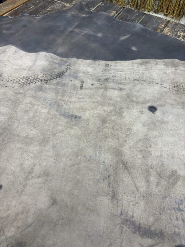 Gray and black textured leather hide.