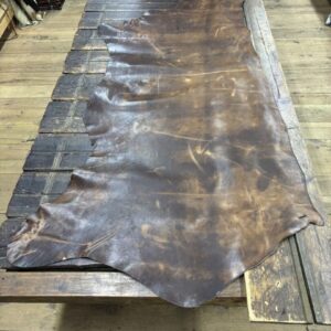 IMG_2832 Brown leather hide on wood table.