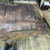 Brown leather on a wooden table.