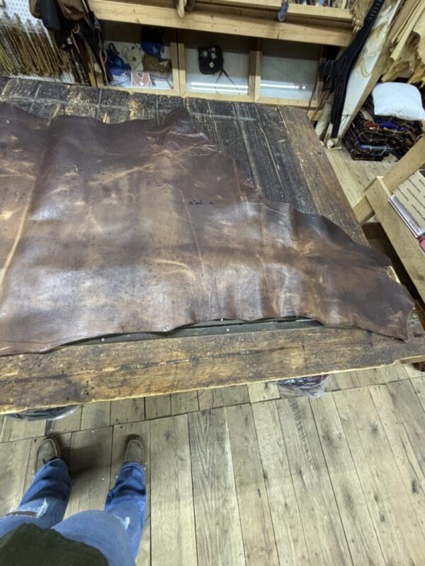 Brown leather on a wooden table.