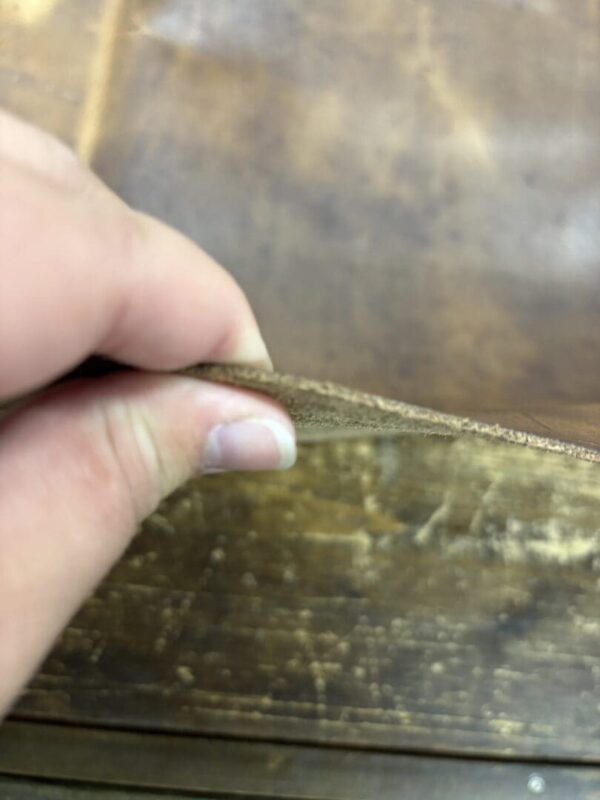 Brown leather texture, close-up view.