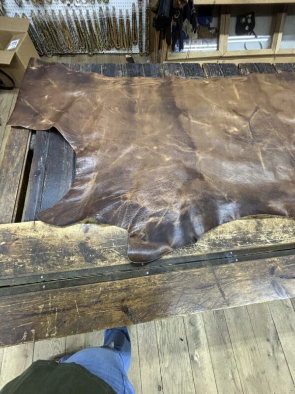 Brown leather on a wooden table.