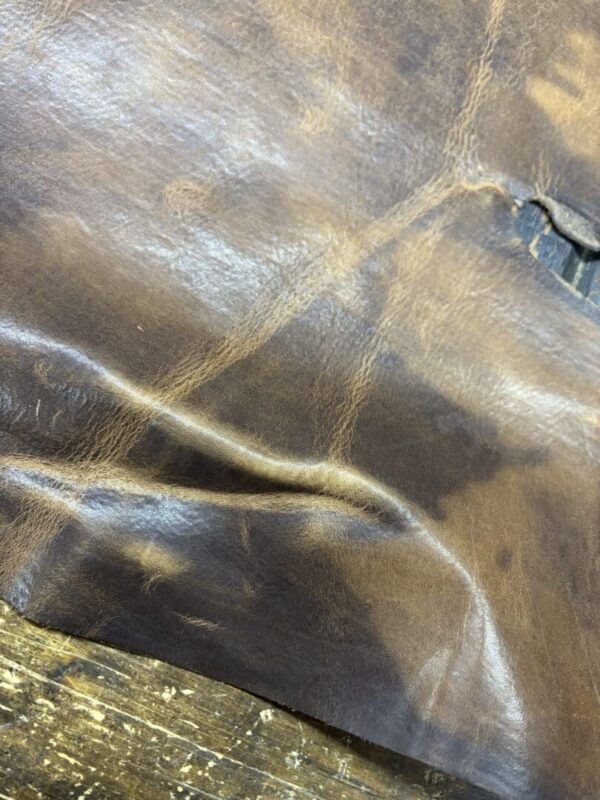 Brown leather with a wrinkled texture.