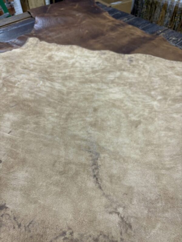 Tan and brown leather hide.