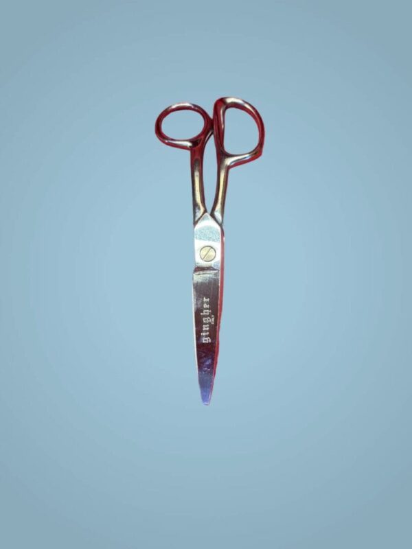 Silver pair of shears with brand name.