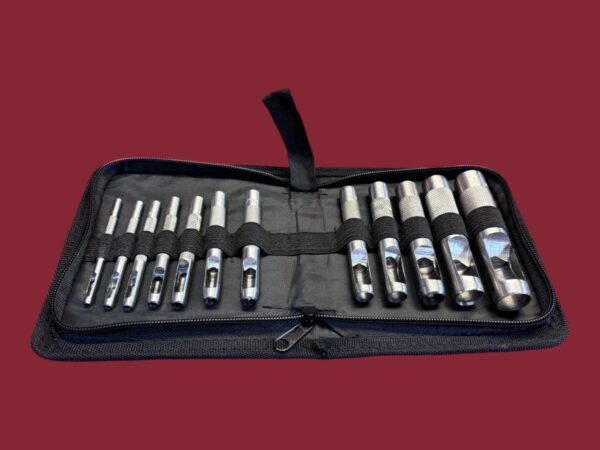Set of hole punch tools in case.