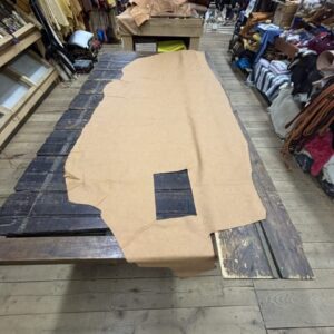 IMG_3045 Brown leather hide on wooden table.