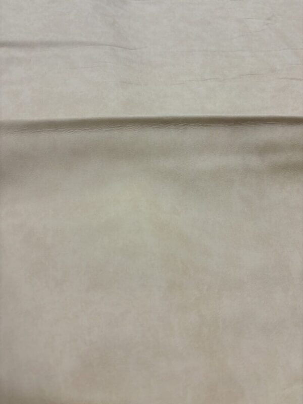 Light beige textured fabric background.