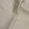 Cream-colored fabric with subtle texture.