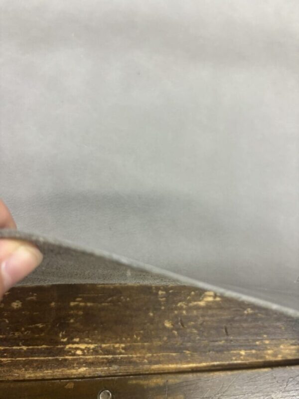 IMG_3070 Grey fabric on a wooden surface.