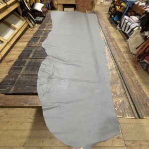 IMG_3074 Gray leather hide on wooden table.