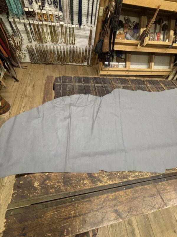 Gray leather on wooden table.