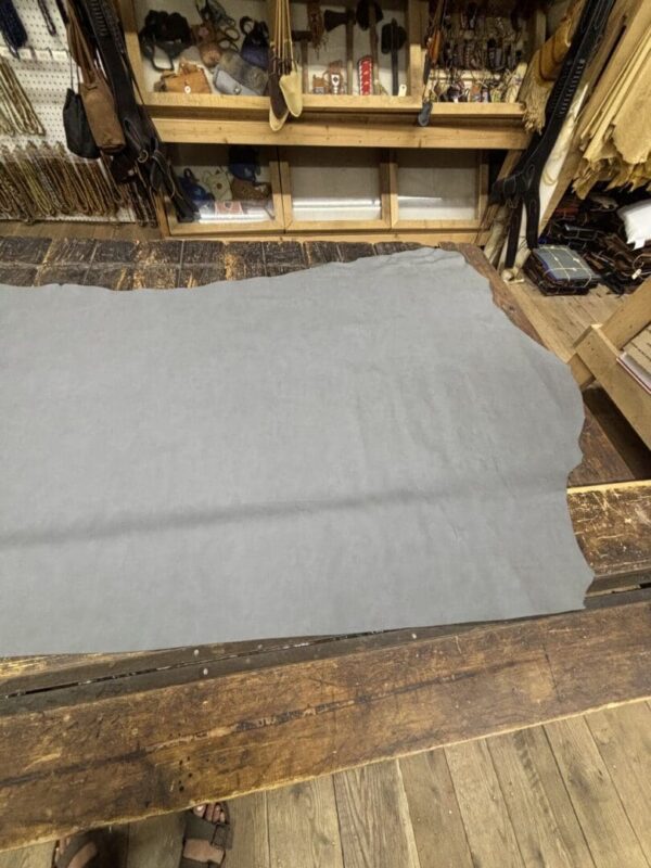 Gray leather hide on wood floor.