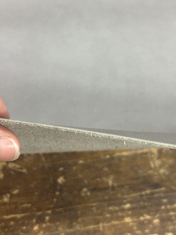 Grey leather being folded back.