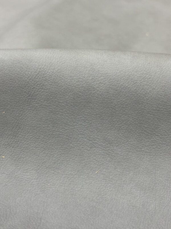 Closeup of gray textured leather.