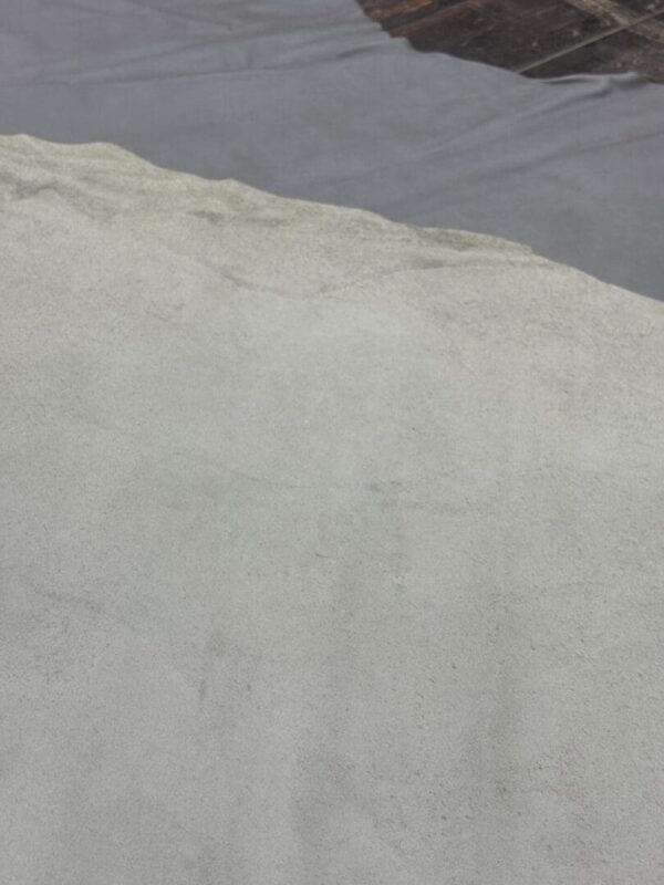 Gray fabric on a white surface.