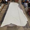 White leather hide on a wooden table.