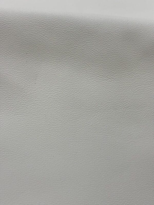 Close-up of textured white leather.