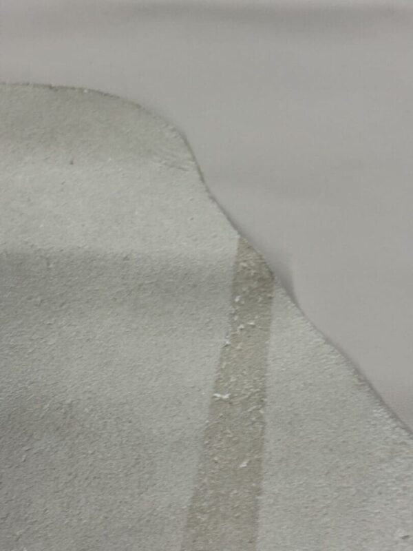 Light gray suede leather swatch.