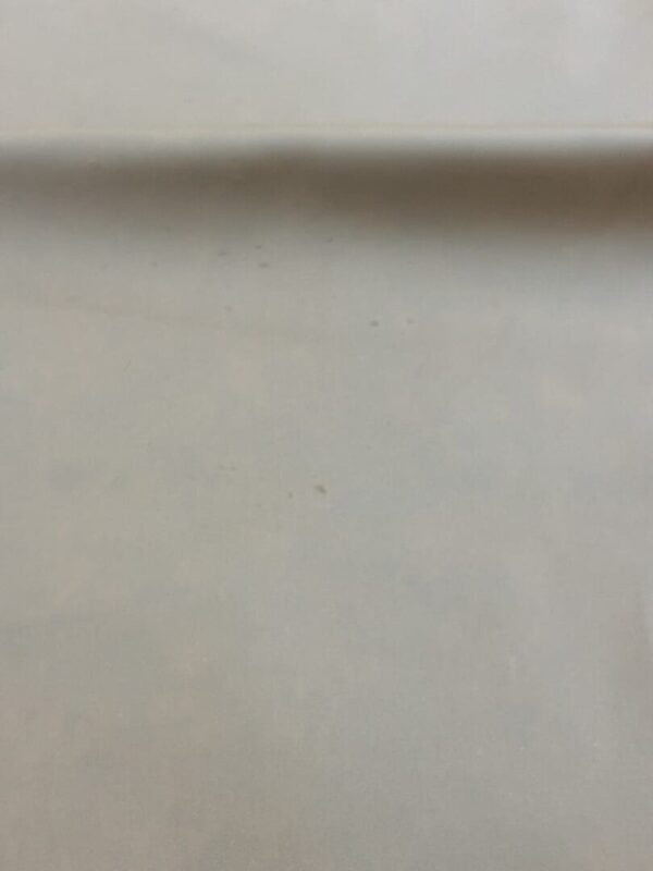 White surface with slight texture.