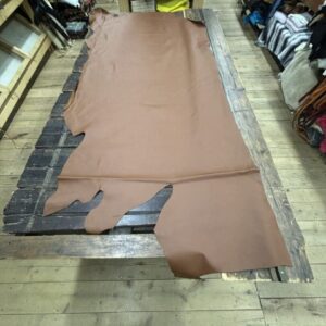 IMG_3104 Brown leather hide on wooden table.