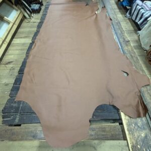 IMG_3111 Brown leather hide on wooden table.