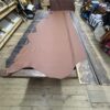 Large brown leather hide on table.