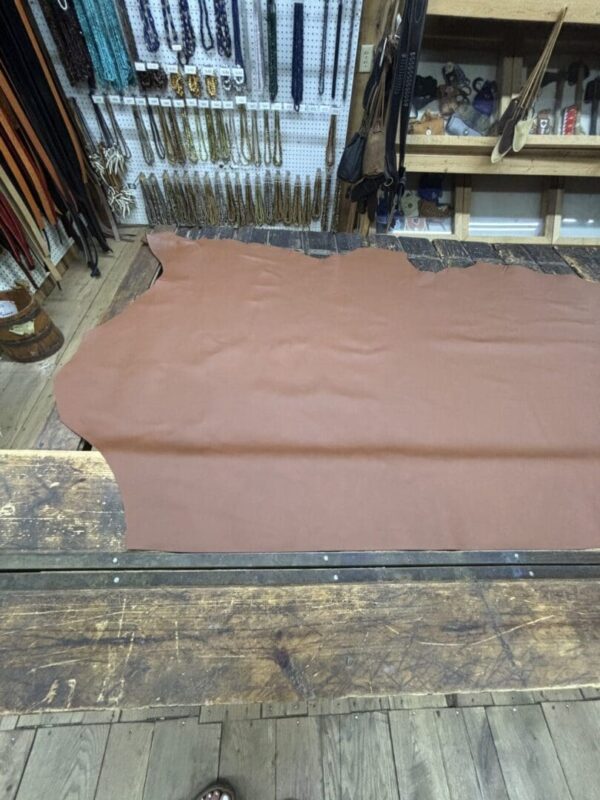 Brown leather on a wooden table.