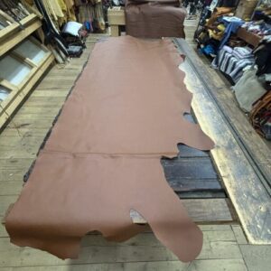 IMG_3123 Brown leather hide on wooden table.