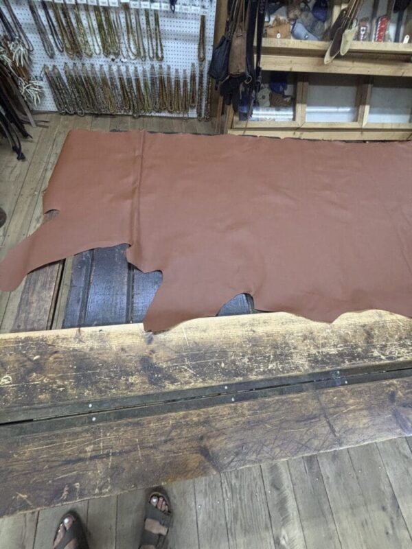 Brown leather on a wooden table.
