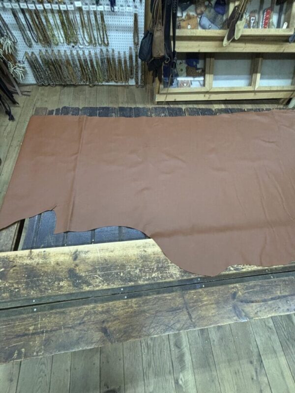 Brown leather on wooden table.