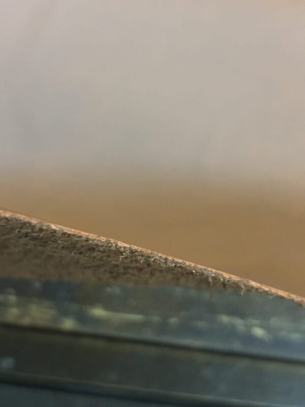 Close-up of brown leather edge.