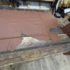 Brown leather hide on wooden table.