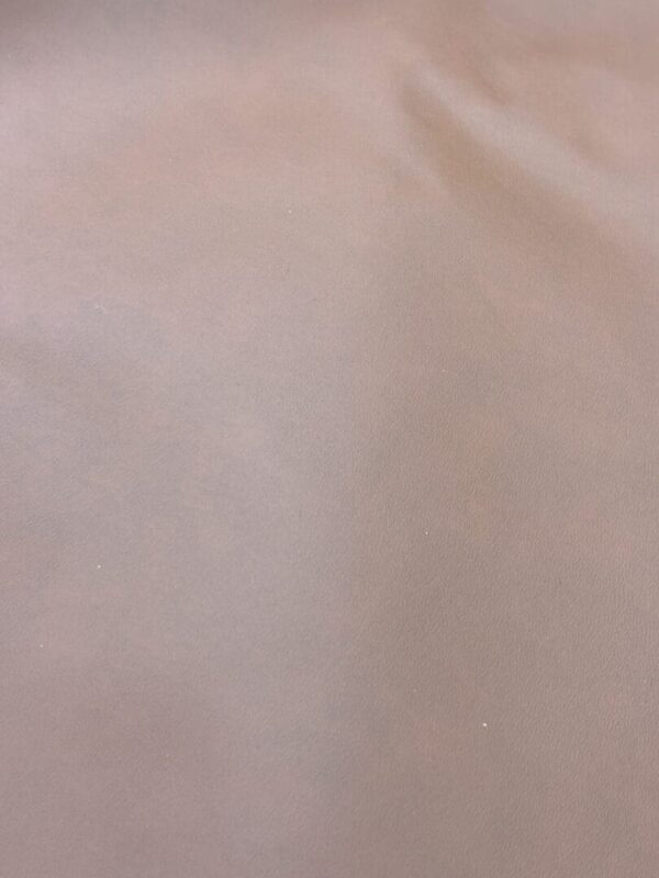 Close-up of light brown leather texture.