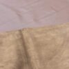 Closeup of light brown suede fabric.
