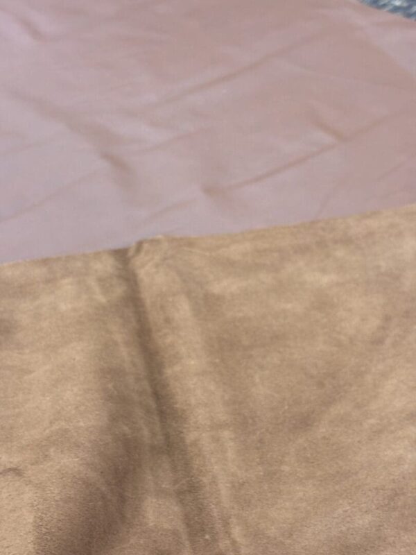 Closeup of light brown suede fabric.