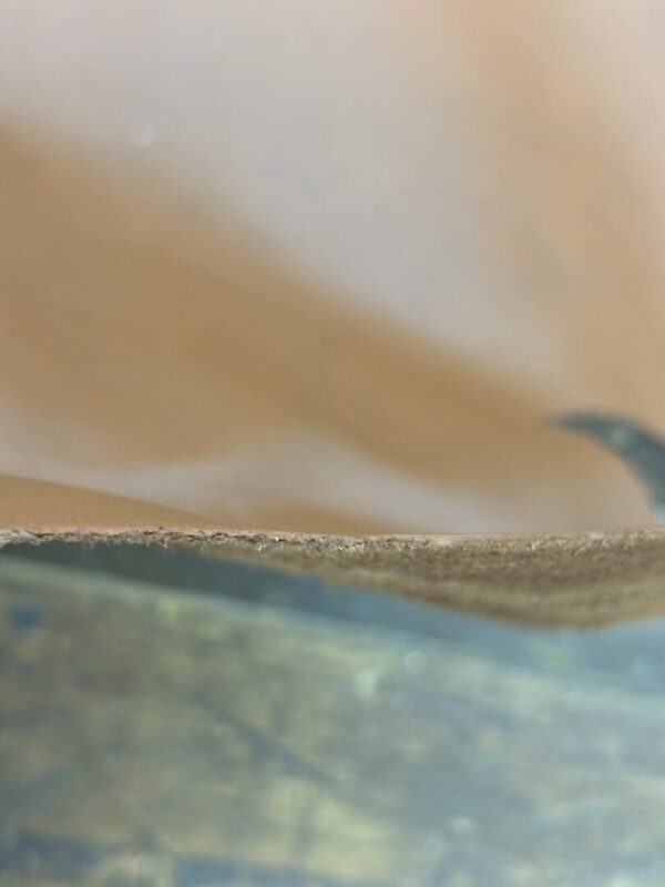 Close up of beige fabric edge.