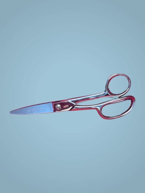 Here's an alt tag for the image: Shiny red Gingher shears.