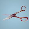 Silver scissors with red handles.