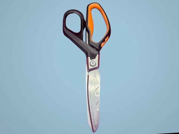 Black and orange scissors on blue background.
