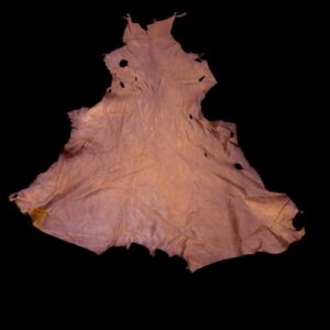 CQNO3929 Brown leather hide on a black background.
