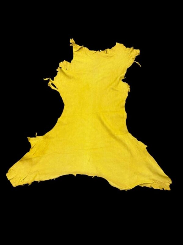 Yellow fabric cut in irregular shape.