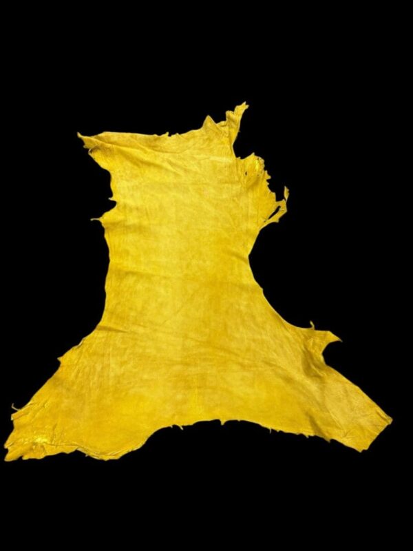 Yellow leather hide on a black background.