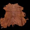 Brown animal hide on a black background.
